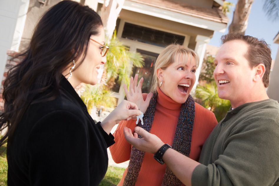 Photodune 281784 Hispanic Female Real Estate Agent Handing Keys to Excited Couple S